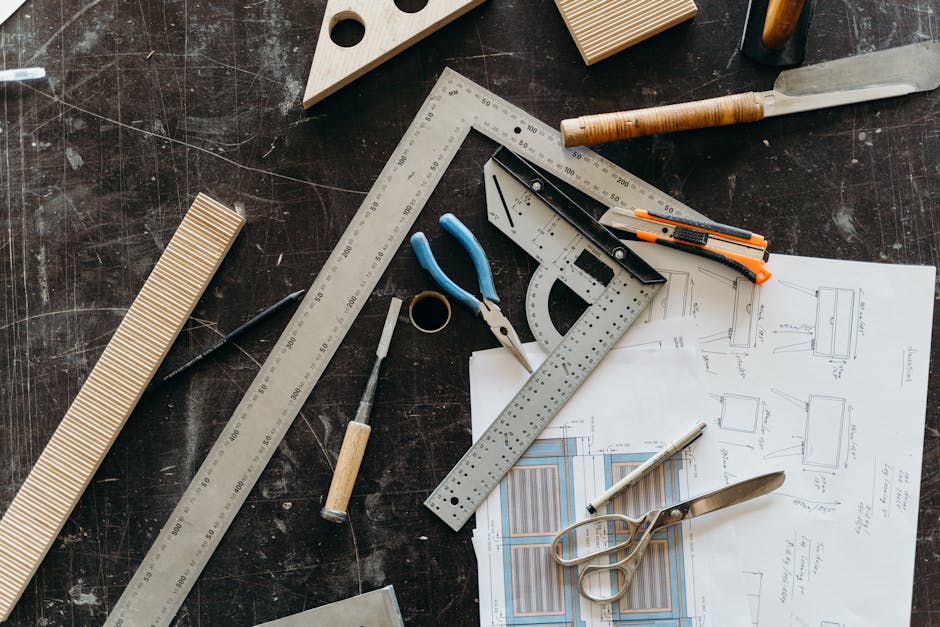 Precision woodworking tools and detailed kitchen blueprints